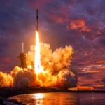 A massive rocket launching at dusk from a coastal pad, with a dramatic orange and purple sky. The rocket is partially through its ascent, engines blazing. Photorealistic digital art, cinematic composition, wide angle shot from ground level looking up.